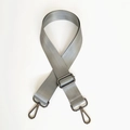 Close-up of grey nylon shoulder strap with metal buckle and herringbone texture - Gray with Gunmetal Hardware