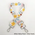 Detail of adjustable white floral bag strap with colorful patterns and silver metal hooks - White & Yellow Floral / Silver