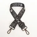 Detail of floral embroidery on adjustable black bag strap with gunmetal swivel hooks - Small Black Floral / Gunmetal