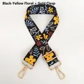 Close-up of adjustable wide woven bag strap with yellow floral patterns and gold hooks - Black and Yellow Flower / Gold