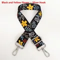 Detail of adjustable black woven bag strap with yellow floral patterns and silver hooks - Black and Yellow Flower / Silver