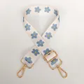 Close-up of adjustable beige floral strap with blue flowers and gold metal hooks - Cream Floral / Gold