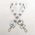 Detail view of floral replacement strap with silver swivel hooks and adjustable buckle - Cream Floral / Silver