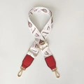 Detail of adjustable wide bag strap with colorful balloon print and gold metal lobster clasp - Hot Air Balloon + Red Leather