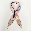 Detail of adjustable wide bag strap with colorful abstract patterns and gold lobster clasps - Silver Hook / Graffiti + Pink Leather