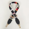 Detail of adjustable ethnic geometric strap with gold metal hooks and leather ends - Silver Hook / Color Wave + Black Leather
