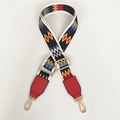 Detail of adjustable ethnic geometric pattern bag strap with red leather and gold lobster clasp - Color Wave + Red Leather
