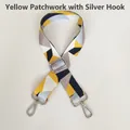 Close-up of adjustable wide shoulder strap with yellow geometric pattern and silver hooks - Yellow Patchwork (Silver Hook)