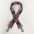 Macro detail of red and black ethnic jacquard bag strap with gunmetal metal hooks - Colorful Geometric With Gunmetal Hook