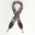 Close-up of ethnic geometric pattern bag strap with gold metal buckles and leather ends - Classic Coffee + Black Leather