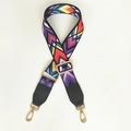 Detail of adjustable wide shoulder strap featuring colorful geometric patterns and gold clips - Color Arrow + Black Leather