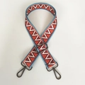 Detail of adjustable ethnic canvas strap with red and blue geometric patterns and black hooks - Triangle Grid With Gunmetal Hook