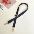 Detail of navy nylon shoulder strap with adjustable golden buckle and lobster clasps - Blue