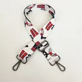 Close-up of adjustable crossbody strap with nautical prints and gunmetal lobster clasps - Windmill Pattern (Gunmetal Hook)