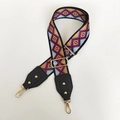 Detail of colorful geometric woven strap with black leather ends and gold metal buckle - Rhombus Grid With Black Leather and Gold Hook