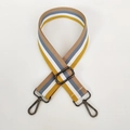 Detail view of 3.8cm striped wide shoulder strap with adjustable gunmetal buckle - Yellow & White Stripe (Gunmetal Hook)