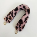 Macro view of plush leopard print faux fur bag strap with golden metal swivel hooks - Length Approx 40cm / Pink Leopard