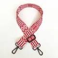 Detail of red and white geometric woven strap with gunmetal swivel hooks and adjustable buckle - A18 Pattern (Gunmetal Hook)
