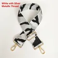 Detail of jacquard camouflage bag strap with white silver threads and gold metal buckle - White & Silver Thread