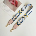 Detail of colorful geometric wave woven bag strap with pink leather and gold metal clips - White Pink and Pink Leather Accent