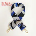Detail of sky blue and silver thread jacquard wide strap with gold metal lobster clasp - Sky Blue & Silver Thread