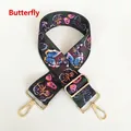 Detail view of canvas handbag strap with colorful butterfly prints and gold metal hooks - Butterfly Print With Gold Hook