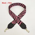 Detail of pink and black zebra pattern wide strap with golden lobster clasps - Black + Pink