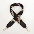 Detail of adjustable wide fabric strap with black geometric pattern and gold hooks - Black (Coffee Leather & Gold Hardware)