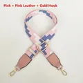 Detailed view of adjustable pink woven bag strap with golden metal hooks and leather trim - Pink (Pink Leather & Gold Hardware)