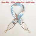 Detail of light blue embroidered bag strap with white leather ends and gold metal hooks - Light Blue (White Leather & Gold Hardware)