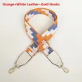 Close-up of adjustable embroidered strap with orange wave pattern and gold metal hooks - Orange (White Leather & Gold Hardware)