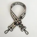 Close-up of adjustable woven purse strap with green and black geometric diamond patterns - Black Grass Green Beige Geometric Style (A45+Gunmetal Hook)
