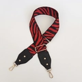 Detail of red and black zebra pattern woven strap with gold rivets and leather ends - Zebra Print (108) / Black Red + Black Leather + Gold Hook