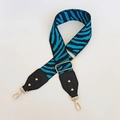 Close-up of adjustable zebra print bag strap with black leather ends and gold rivets - Zebra Print (108) / Blue Stripe with Black Leather and Gold Hook