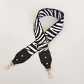 Detail of adjustable zebra print bag strap with golden metal buckles and black leather ends - Zebra Print (108) / White with Black Leather and Gold Hook