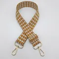 Detail view of mustard yellow houndstooth pattern wide woven bag strap with gold buckles - Silver Hook / Ginger and White-Silver Hook (12)