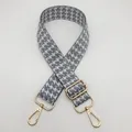 Detail of adjustable houndstooth bag strap with gold metal buckle and gray-white weave - Silver Hook / Grey and White-Silver Hook (13)