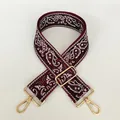 Close-up of a 5cm wide red canvas strap with white paisley patterns and gold metal hooks - No. 4 (No. 4 + Silver Hook)