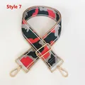 Macro detail of number 7 nylon shoulder strap with camouflage pattern and gold hooks - Red Green Gray Camo (No. 7 + Gold Hook)