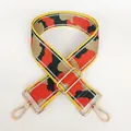 Close-up of adjustable camo nylon strap with gold swivel hooks and yellow edging trim - Red Green Yellow Edge Jacquard (No. 15 + Gold Hook)