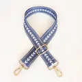 Detail of grey-blue woven strap with white chevron patterns and gold metal lobster clasps - Grey Blue + Gold Hook