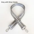 Detail view of grey nylon shoulder strap with white patterns and silver metal hooks - Grey + Silver Hook