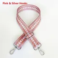 Detail of pink nylon shoulder strap with white jacquard arrow pattern and silver hooks - Pink + Silver Hook