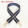 Close-up of adjustable blue nylon strap with white arrow pattern and gold metal hooks - Blue + Gold Hook