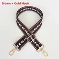 Detail of adjustable coffee nylon strap with white arrow pattern and gold metal hooks - Coffee + Gold Hook