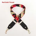 Detail view of red and gold jacquard bag strap with metal buckle and black leather ends - Red & Gold Thread