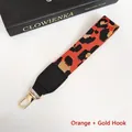 Detail of orange leopard print phone strap with clear texture and gold spring hook - Orange + Gold Hook