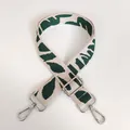 Detail view of embroidered beige bag strap with green leaf patterns and silver metal clasps - Leopard Style 3 with Silver Hook