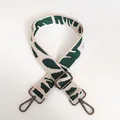 Detail of adjustable woven shoulder strap with green leaf pattern and dark metal hooks - Leopard Style 3 with Gunmetal Hook