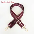 Close-up of wine red nylon strap with white arrow pattern and golden metal hooks - Purple + Gold Hook